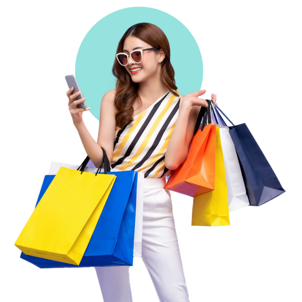 A fashionable woman with shopping bags, wearing sunglasses, holding her phone
