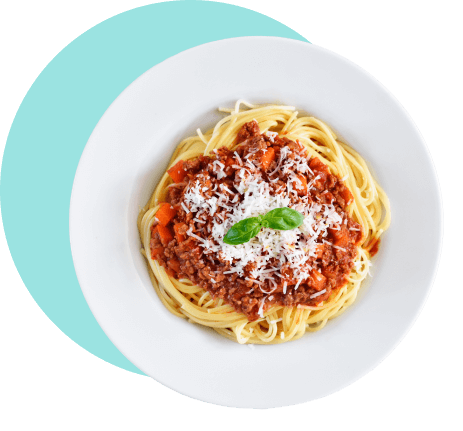 A white ceramic plate, topped with spaghetti and marinara sauce