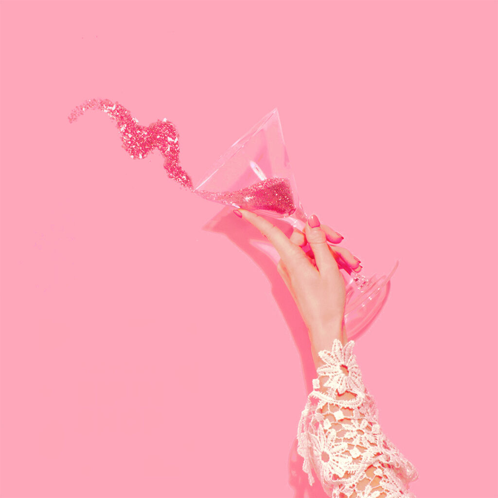 martini glass with pink glitter splashing