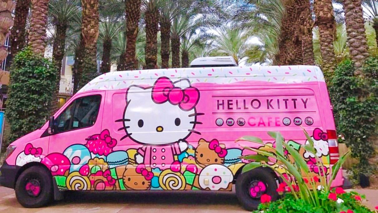 Pink Hello Kitty truck parked near the palm trees at Scottsdale Quarter