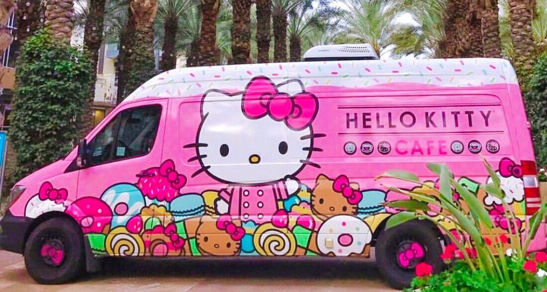 Pink Hello Kitty truck parked near the palm trees at Scottsdale Quarter