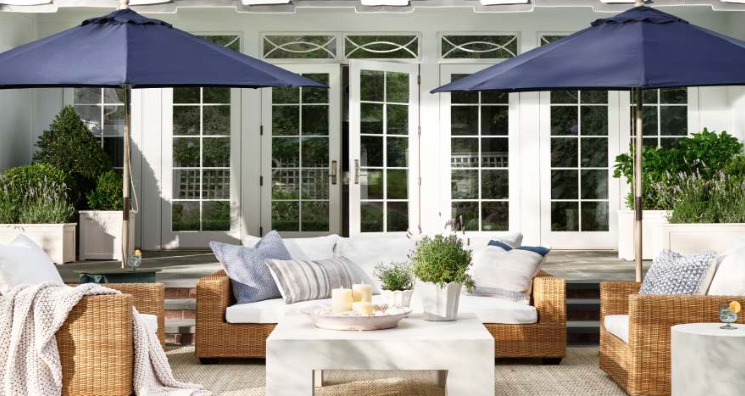 An outdoor patio with navy and white decor