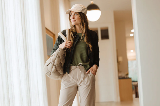 A woman in neutral-colored athleisure wear