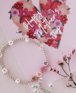 a beaded bracelet on a floral background