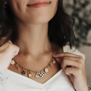 A woman wearing a charm necklace