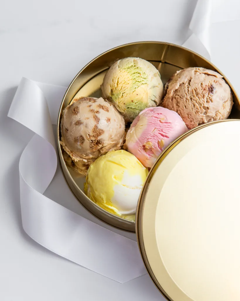 Colorful scoops of ice cream in a tin.