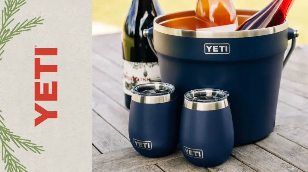 A YETI bucket and wine tumblers in navy blue