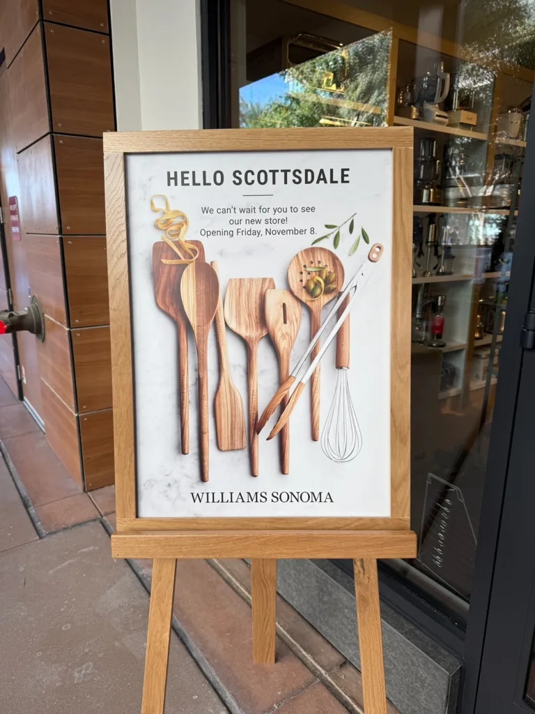 An easel sign out front of Williams Sonoma