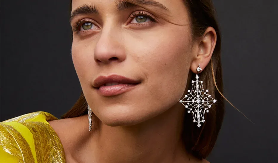 Close up view of a woman wearing large earrings