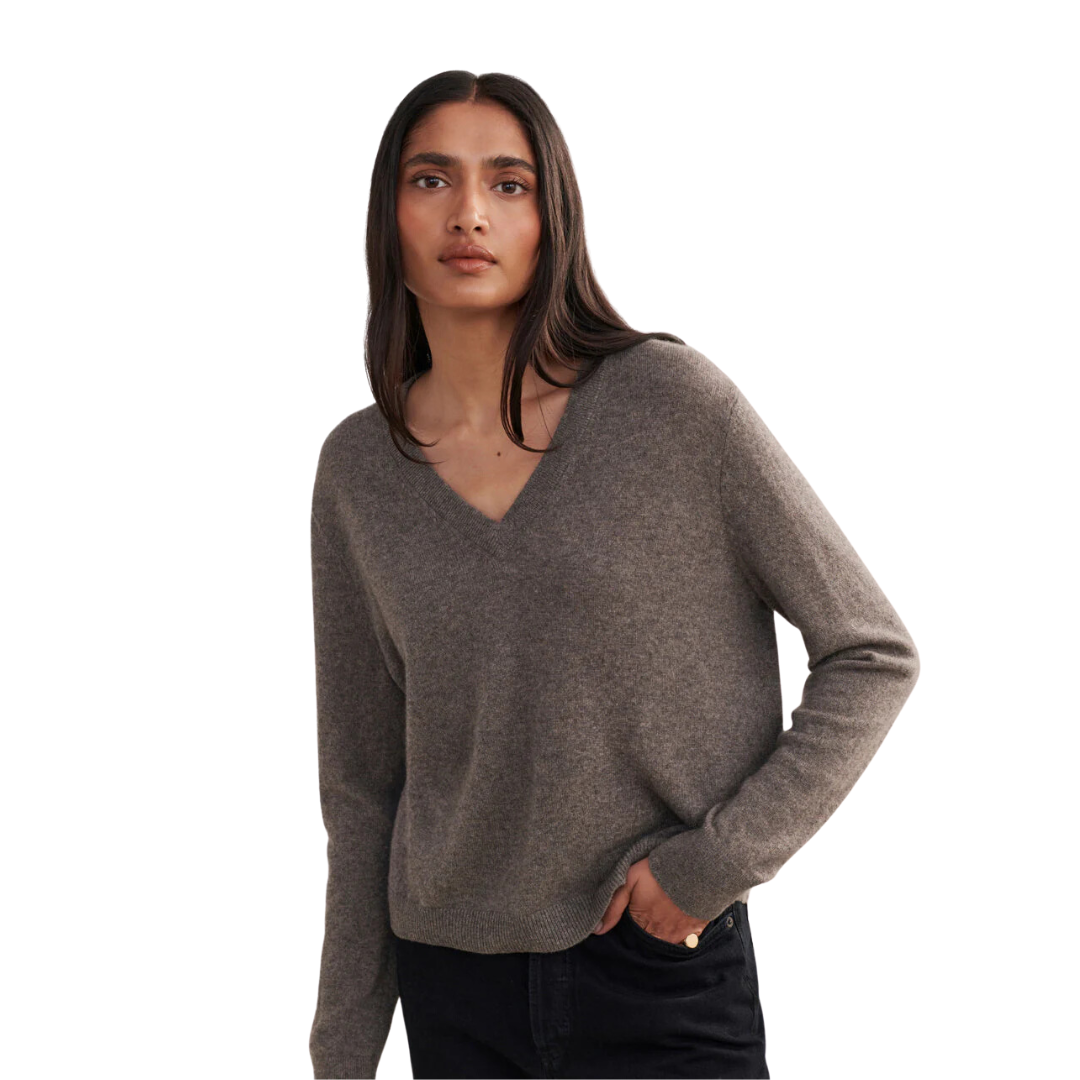 a woman wearing a brown cashmere sweater