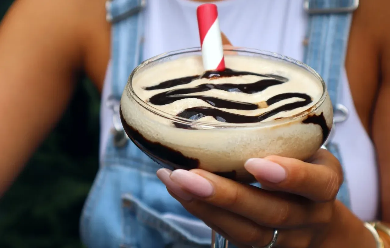 a person holding a frozen espresso martini