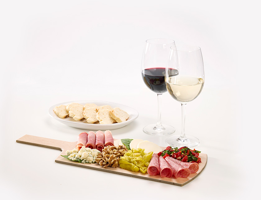 A charcuterie board and two glasses of wine