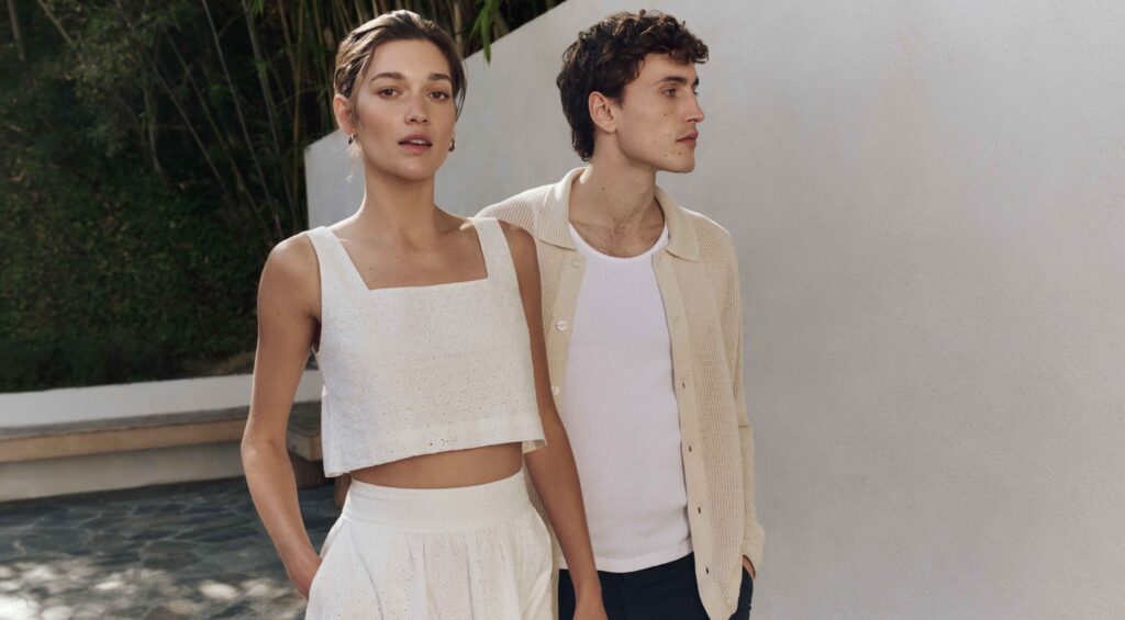 A stylish couple walking outside