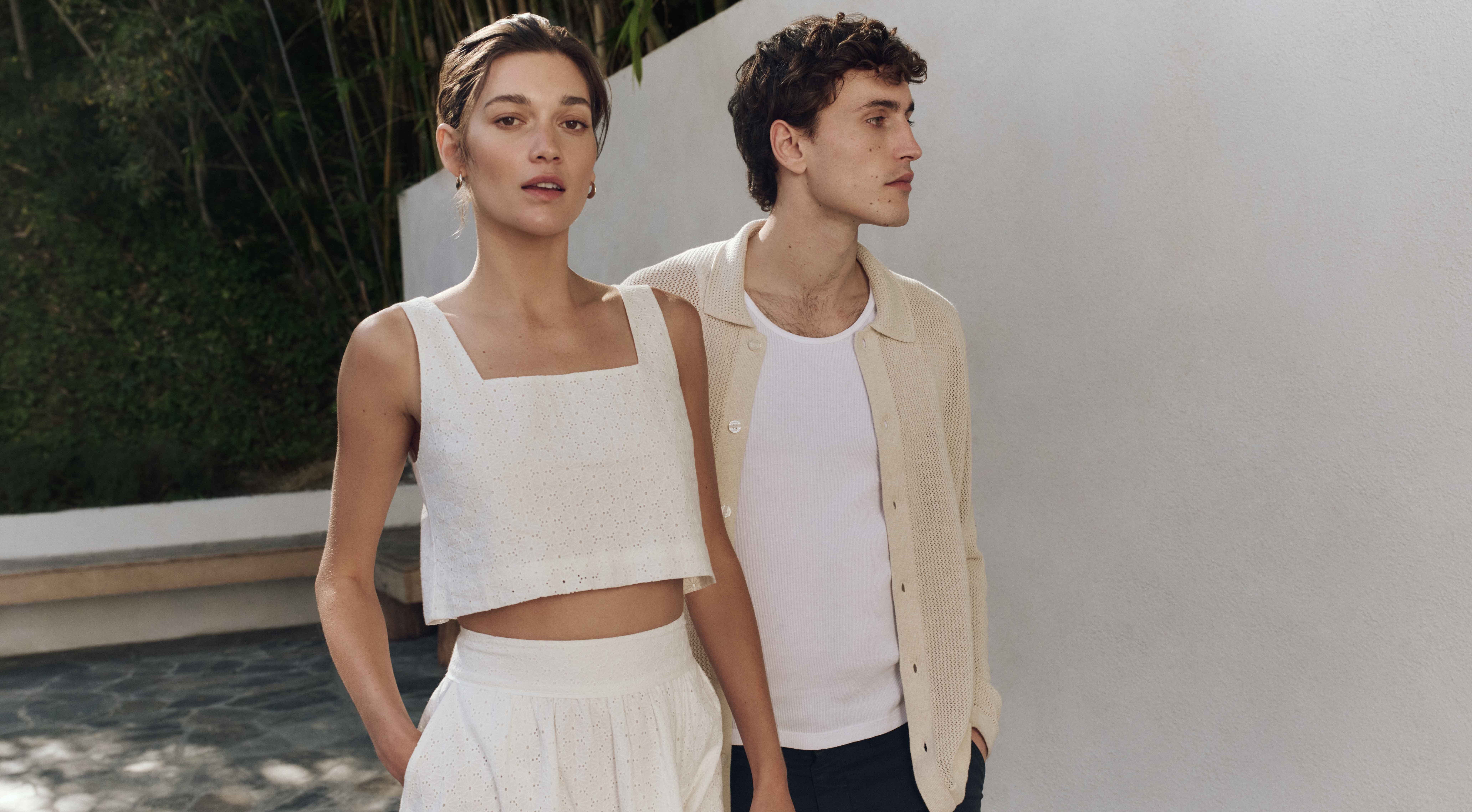 A stylish couple walking outside