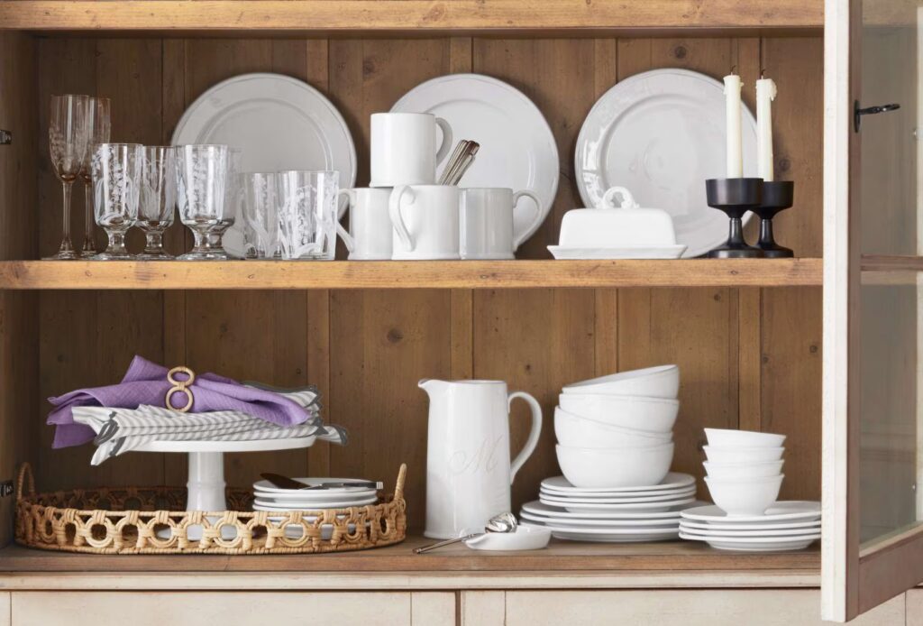 A hutch filled with white china