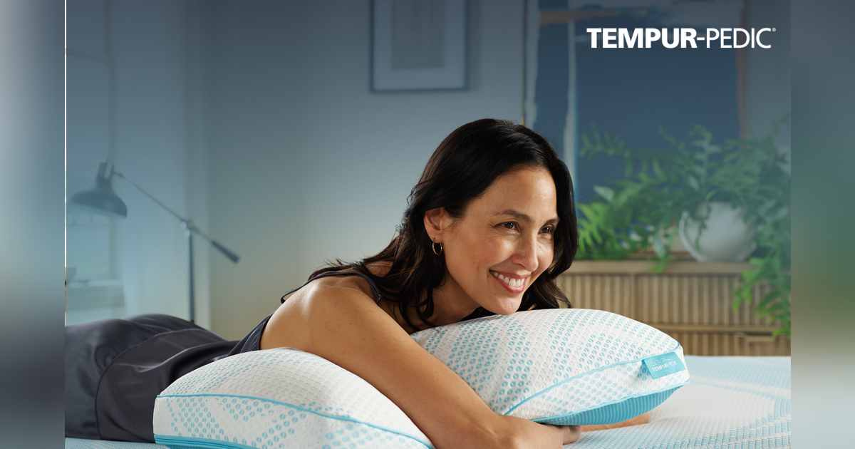 A woman lying on top of a pillow