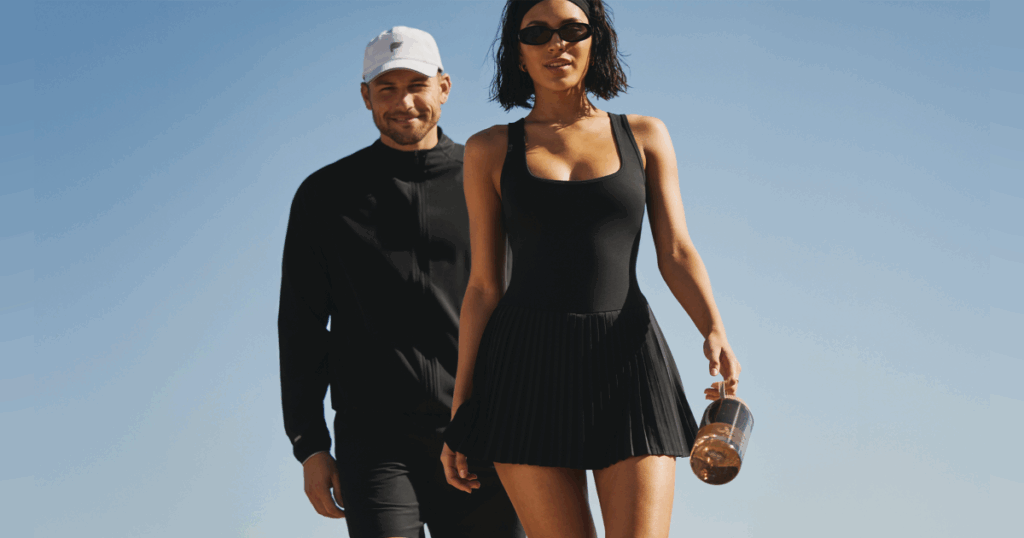 Two people in athletic clothing outside