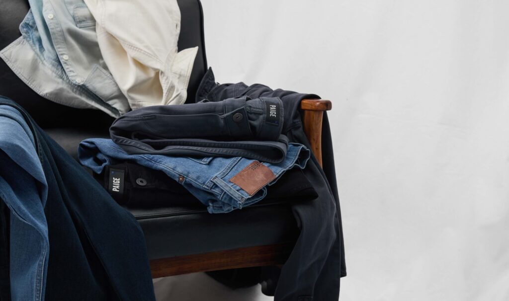 A pile of clothing draped on a chair