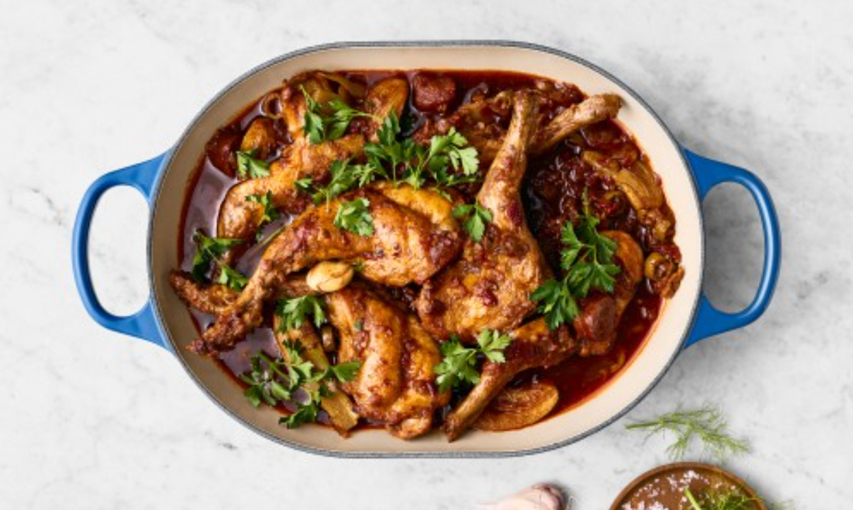 An oven dish filled with chicken and sauce