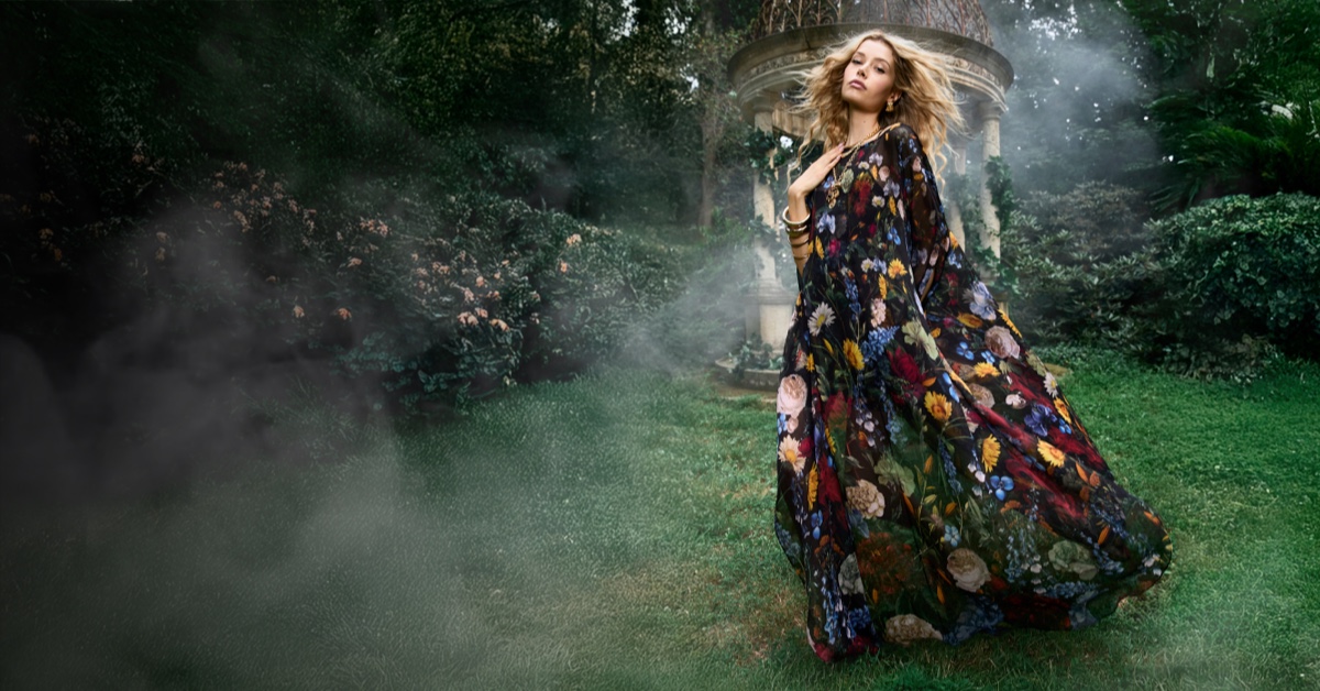 a woman in a whimsical garden setting