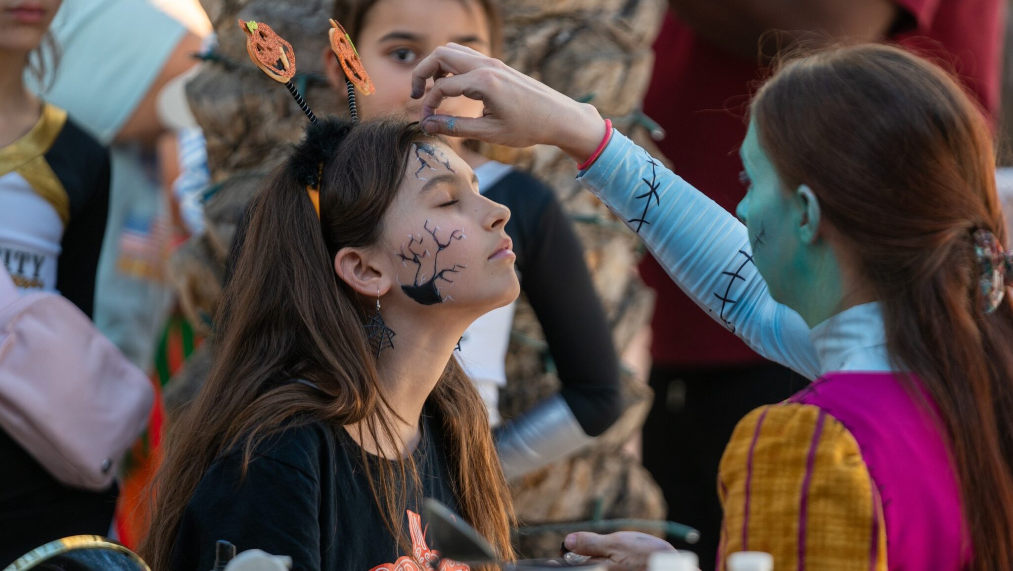 A girl getting her face painted