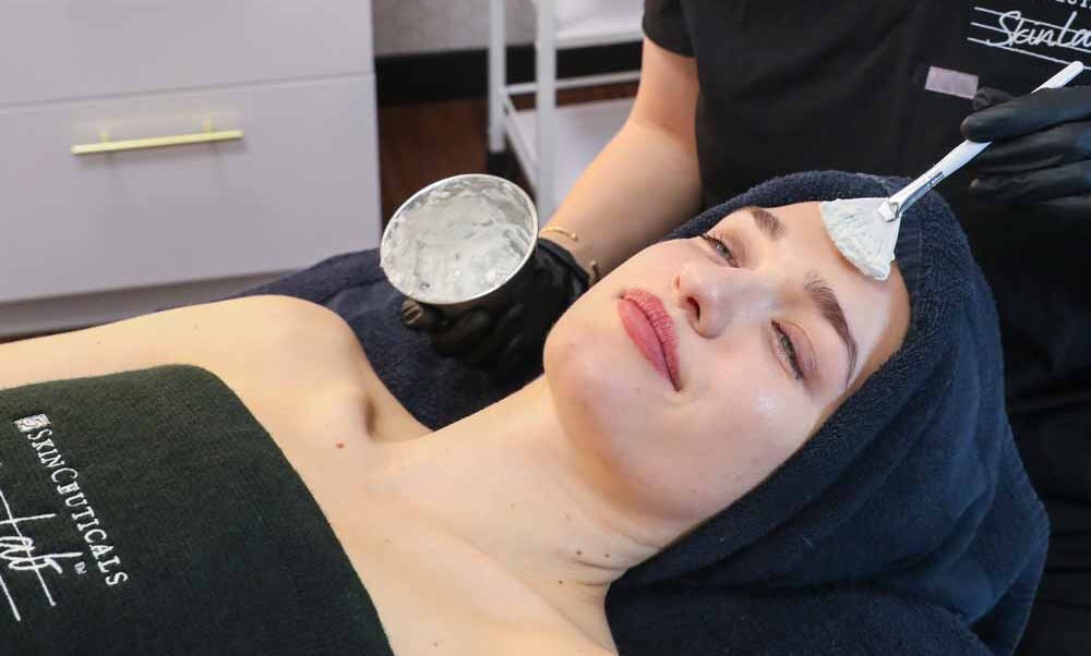 A woman getting a facial at SkinLab