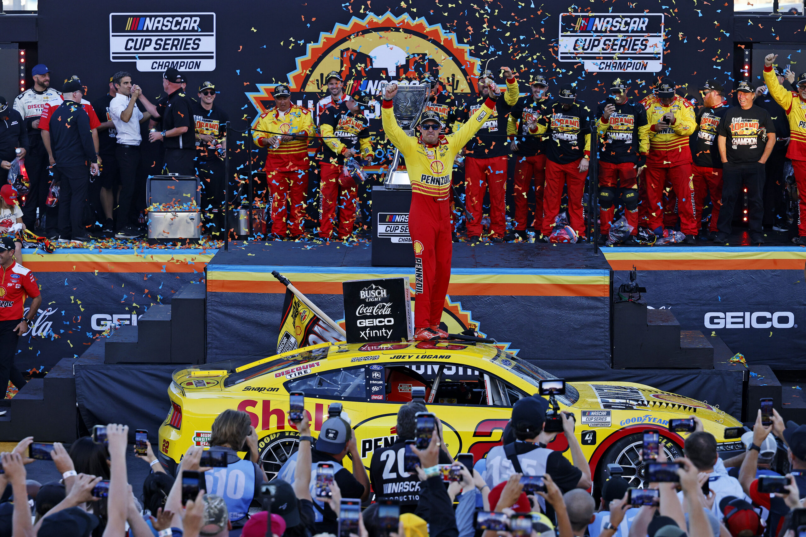 winner on top of a nascar car