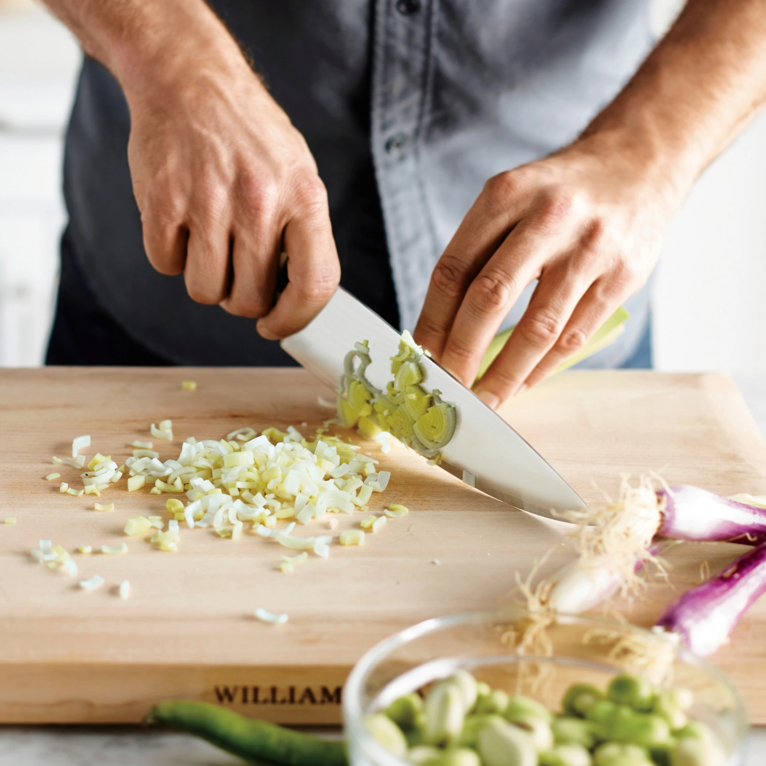 Person cutting an onion