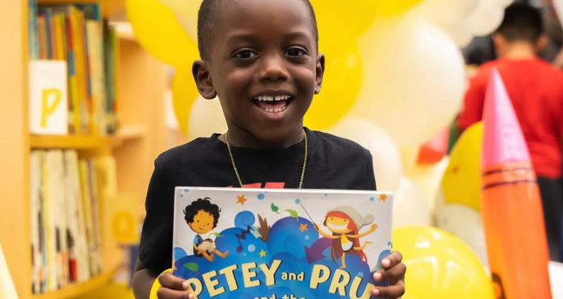 kid holding a book