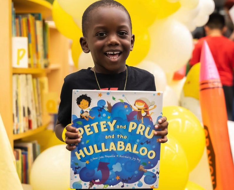kid holding a book