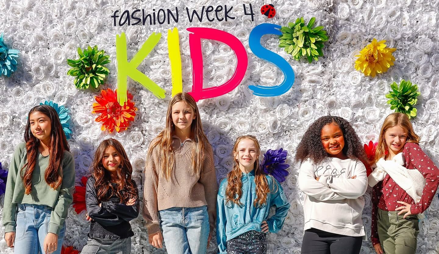Kids in front of a backdrop